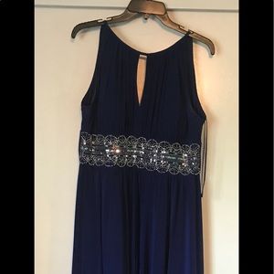 Full length navy blue formal gown.